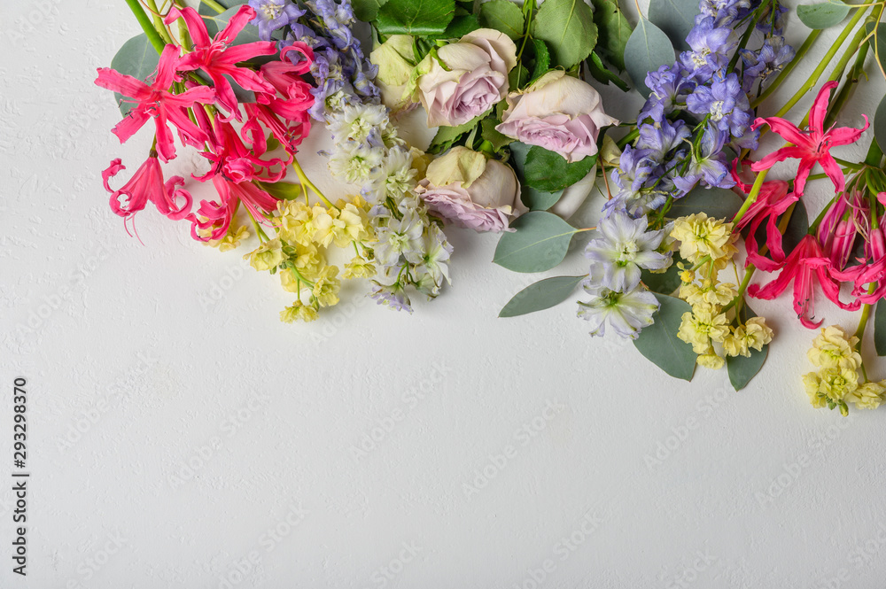 Bouquet of different flowers at the top on a light background Bouquet of different flowers at the top on a light background