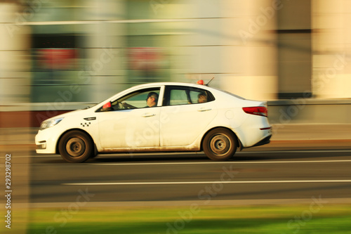 Fototapeta Naklejka Na Ścianę i Meble -  dirty taxi car in motion around the city. blur