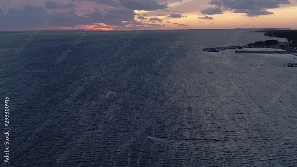 Silhouette Of A Man On A Kite-Board In The Sea At Sunset, Aerial View