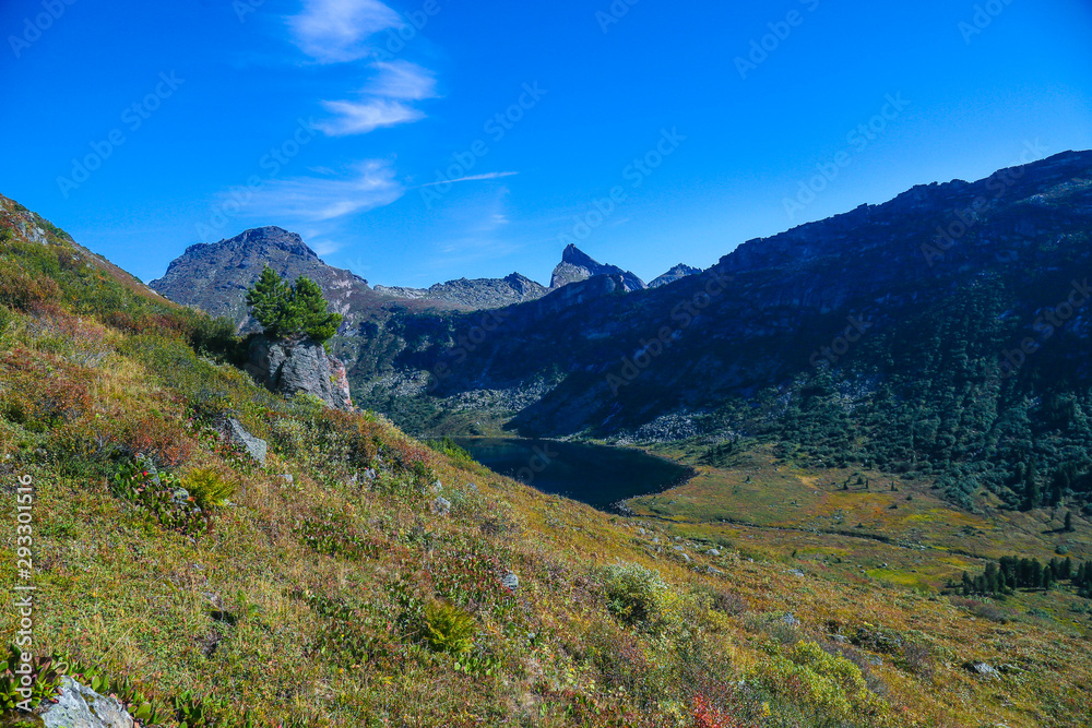 Obraz premium mountain landscape with distant forest and lake 