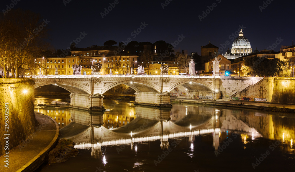 Rome, Italy, February 20, 2017 - view of Rome and Vatican, Italy. Tiber River with bridges in Rome. Beautiful scenic panorama of Rome city. Night photo