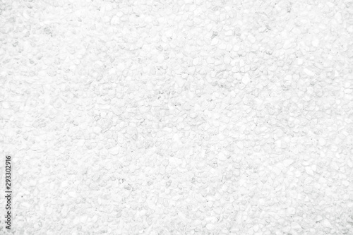 White texture exposed aggregate concrete wall  white grey light background photo