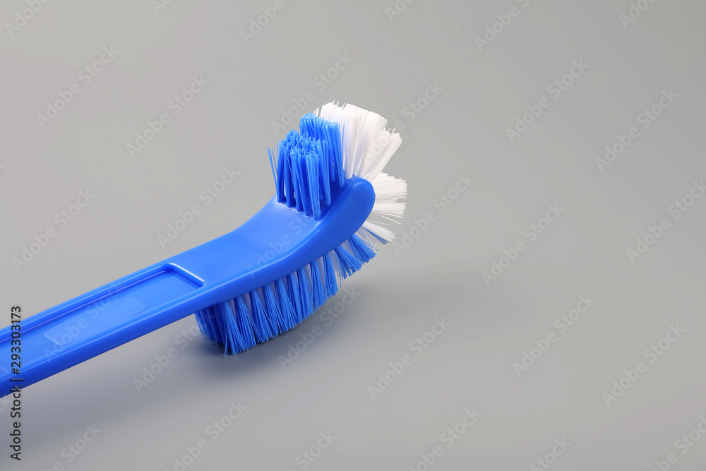 Toilet brush isolated on gray background Toilet brush isolated on gray background