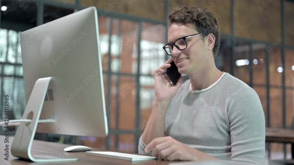 Cheerful Guy talking and Smiling on Cellphone Cheerful Guy talking and Smiling on Cellphone