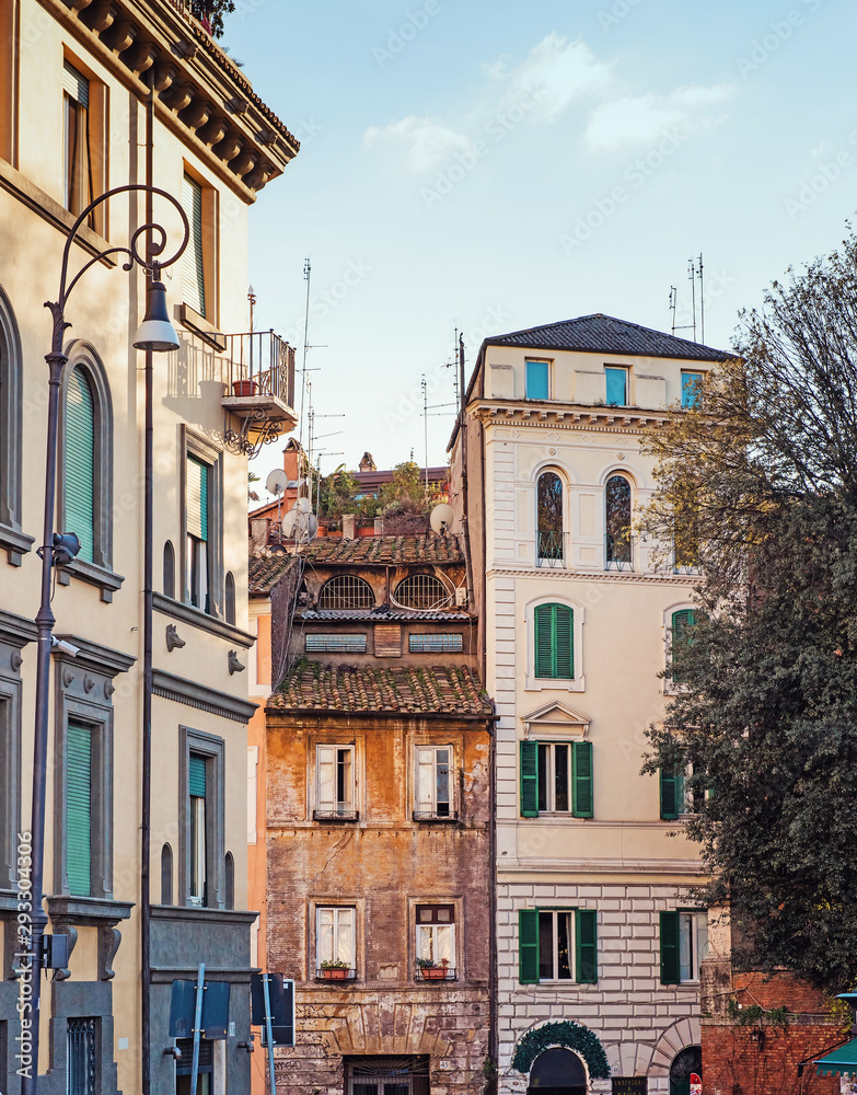 Old street in Rome and buildings facades, Italy. View of old cozy street in Rome in Trastevere.