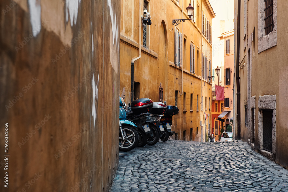 Old cobblestone narrow street in Rome, Italy