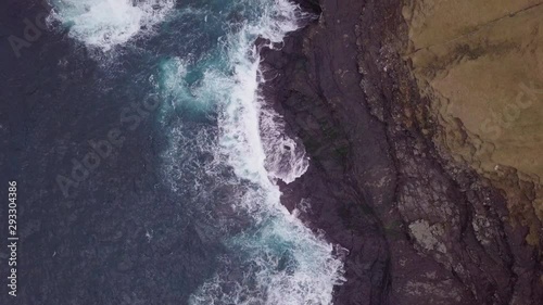 Ocean with waves and rocky cliffs, Faroe Islands, Denmark