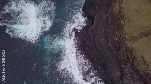Aerial View Of Splashing Ocean Waves Of Cliff, Faroe Islands, Denmark