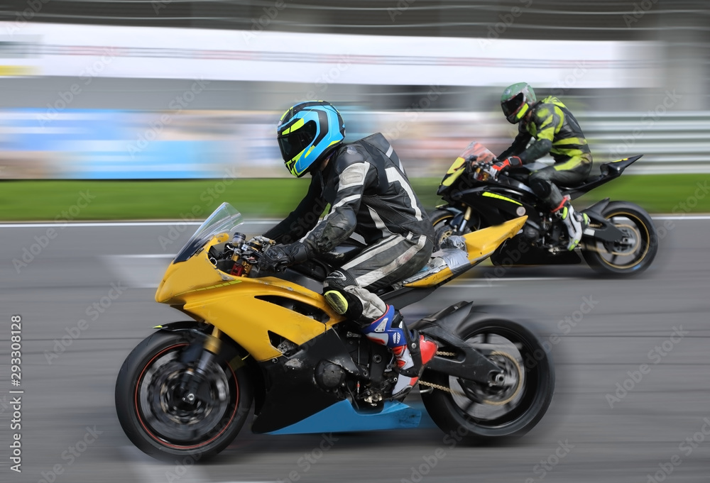 Motorcycle racers compete on the race track