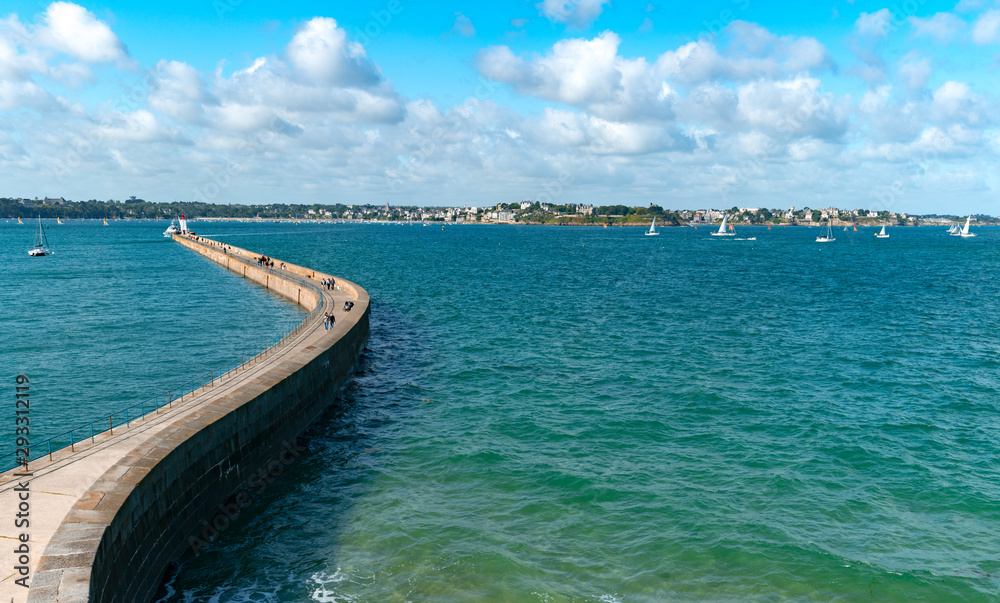 panorama view of the long and winding stone harbor jetty in Saint-Malo