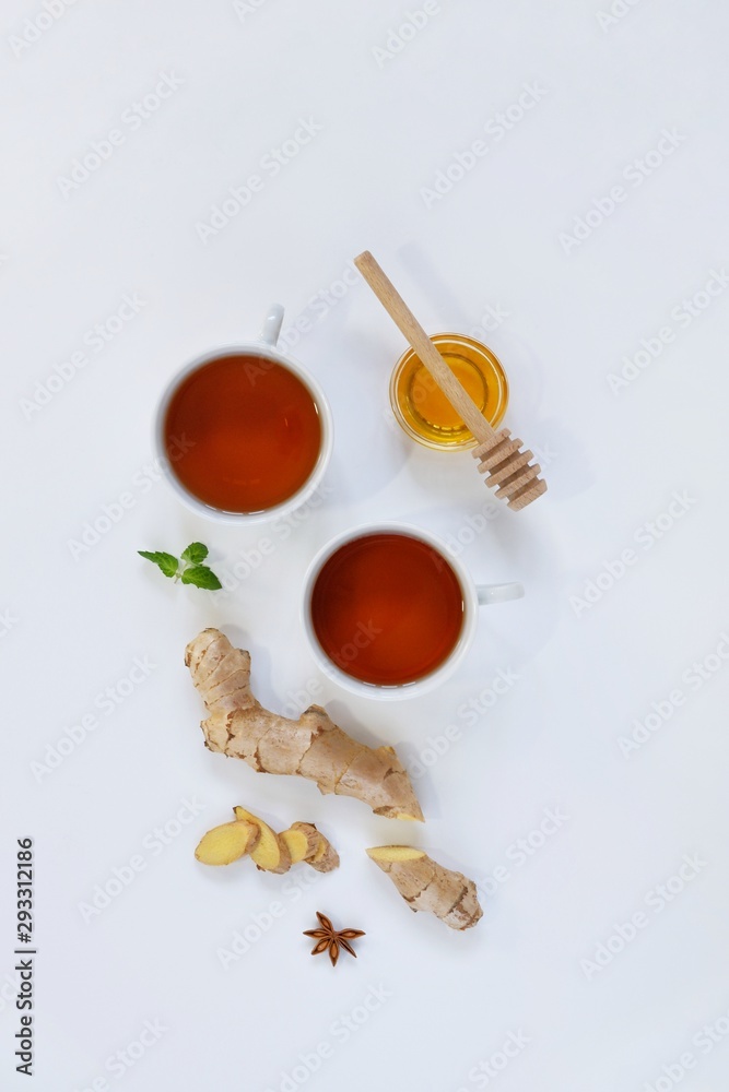 Fototapeta premium Ingredients for herbal ginger tea with honey, star anise and anise. Healthy food detox concept. Flat lay with space for text. Top view.