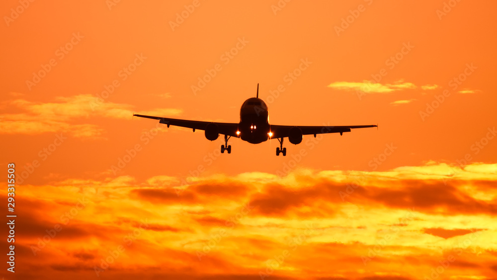 air plane in sunset sky