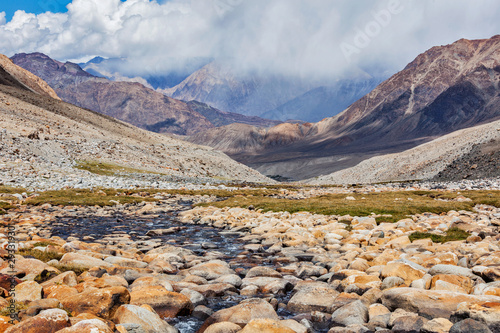 Mountain stream in Himalayas photo