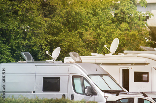 Satellite dishes on caravans. Electronic equipment on vans and campers for receiving video signals (copy space on the top of the image)