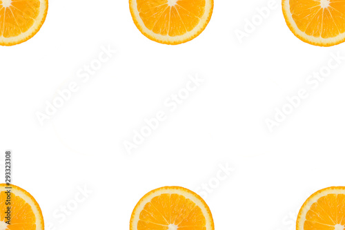 Colorful fruit pattern of fresh orange or lemon slices in the corners on white isolated background. Top view. Copy space.