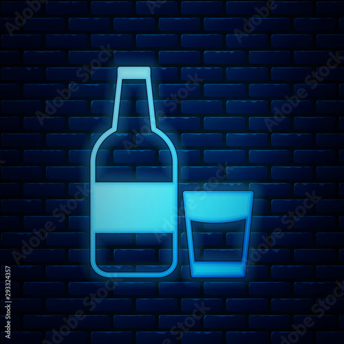 Glowing neon Closed glass bottle with milk and glass icon isolated on brick wall background. Vector Illustration