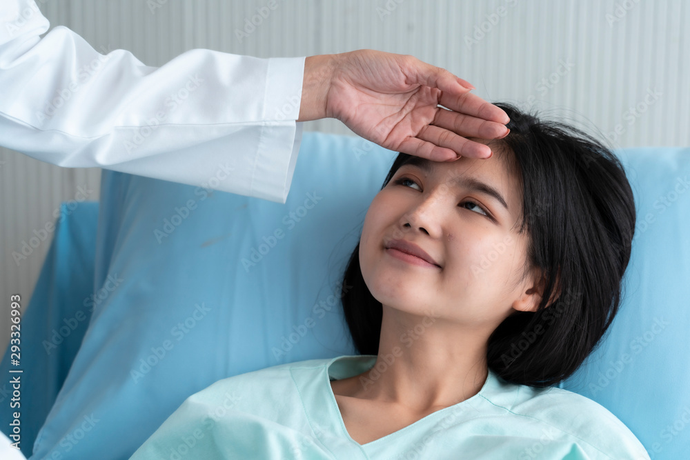 Fototapeta premium A doctor is taking care of a sick young woman with seasonal infections flu