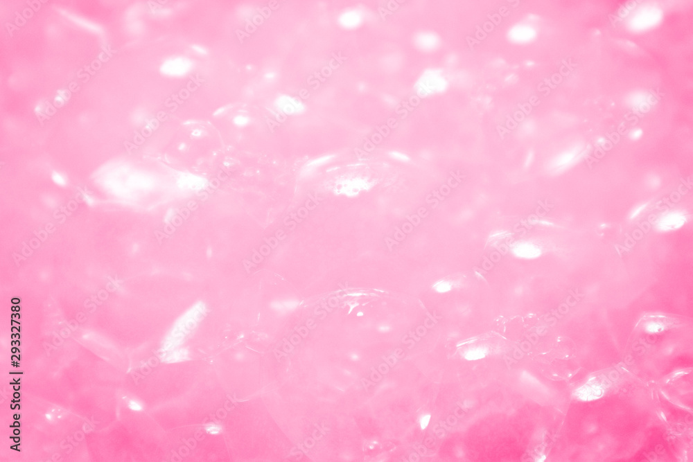 Beautiful abstract texture color white and pink bubbles background in water on pink background pattern clear soapy shiny