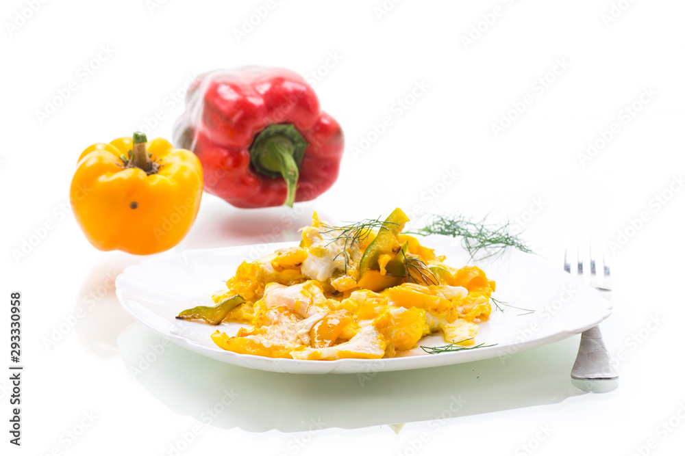 fried omelet from homemade eggs with sweet yellow pepper in a plate fried omelet from homemade eggs with sweet yellow pepper in a plate