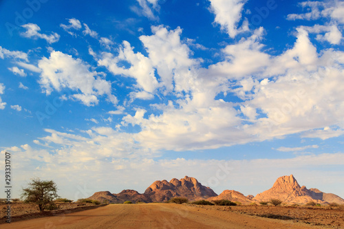 Gravel road leading to Spitzkoppe and the Erongo mountains  Namibia  Africa