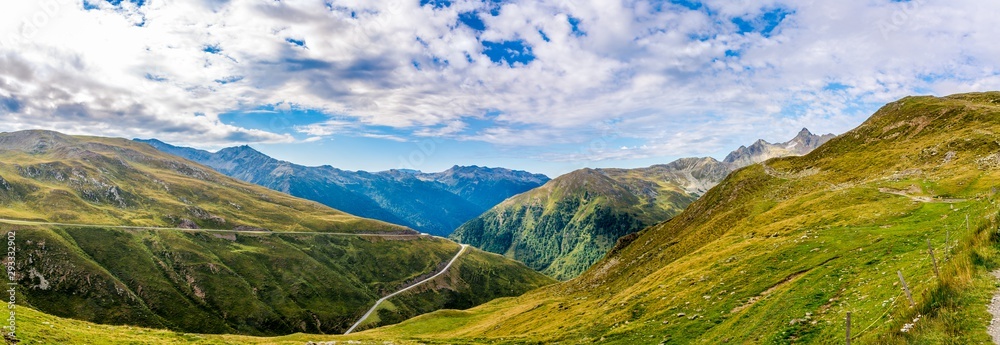 Fototapeta premium Panoramic view at the Valley with road to Pennes Pass in South Tyrol - Italy