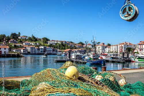 Saint-Jean-de-Luz, France -  View of the harbor, houses and fishing nets photo