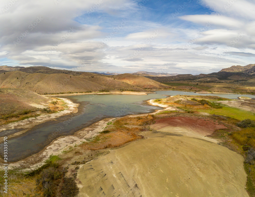 Audacious aerial Photography of the vibrant and  photogenic John Day Fossil Beds and the iridescent Painted Hills Reservoir of Wheeler County in Mitchell, Oregon
