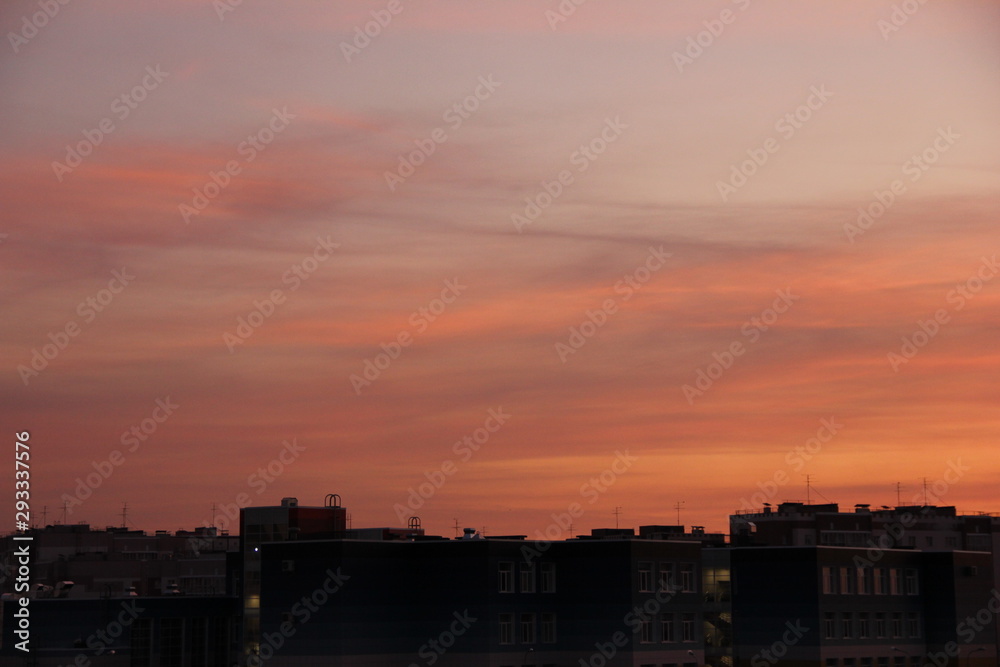 Naklejka premium beautiful sunrise on the city. Heaven is like candy floss