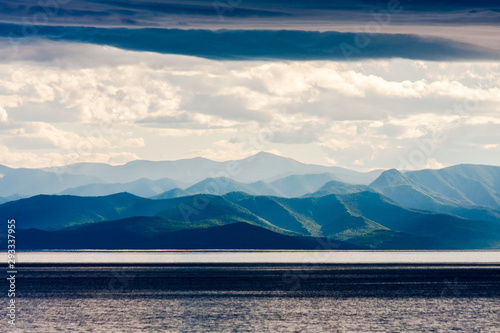 Landscape with lake and mountains in cloudy weather. Baikal Lake © Riwkus