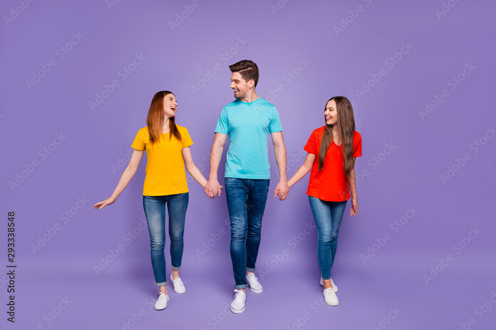 Fototapeta premium Full length body size photo of excited positive optimistic buddies hipsters having fun and sincere conversation isolated violet background