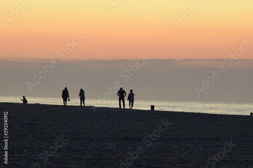 Family walking on the beach © MRoseboom