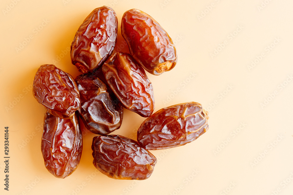 Dates close-up isolated on the table. Dried fruits, healthy and diet food Dates close-up isolated on the table. Dried fruits, healthy and diet food
