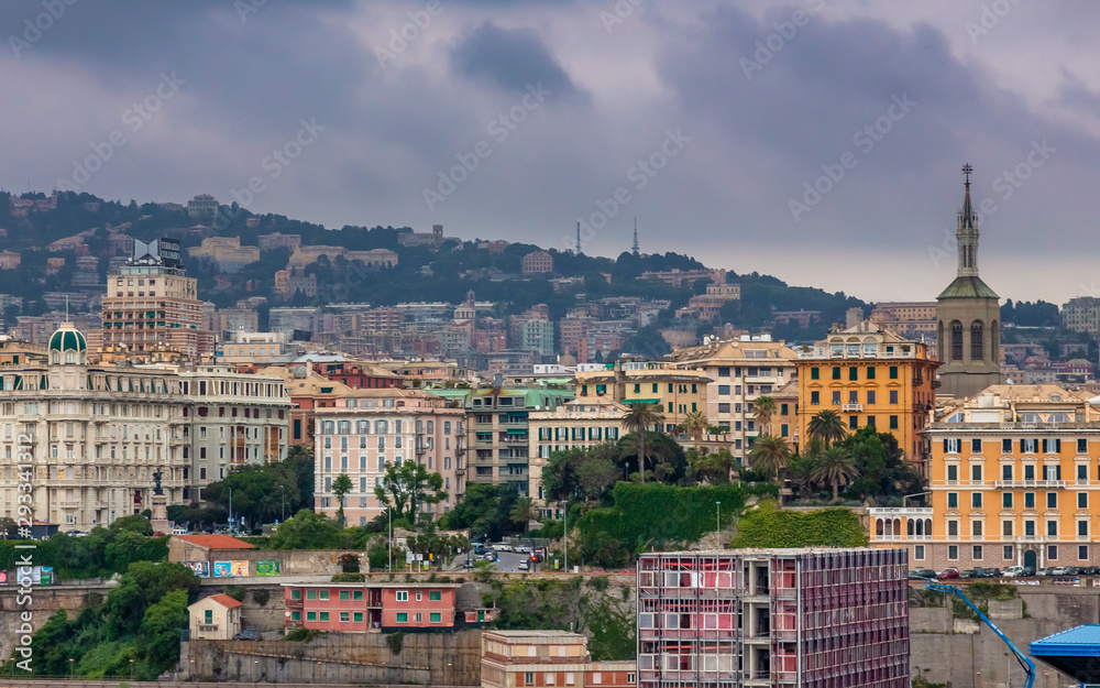 Genoa Panoramic View. Exposure of Genoa (Genova) from an high angle view at sunrise featuring the port and city.