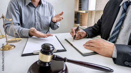 Judge gavel with scales of justice, Businessman and lawyer or counselor consulting and discussing contract papers at law firm in office