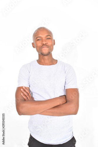 portrait of a young man with arms crossed