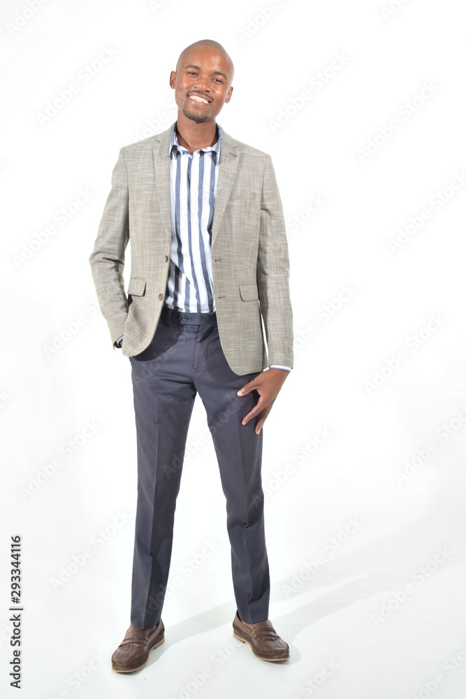 portrait of a handsome man in suit with hands on pockets portrait of a handsome man in suit with hands on pockets