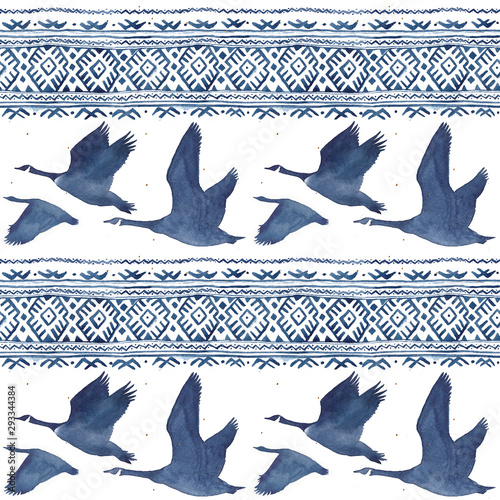 Seamless pattern with watercolor realistic a flock of geese silhouette and national ornament in blue colors