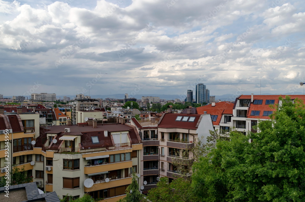 Residential neighborhood with new modern houses against the backdrop of a cityscape in the Bulgarian capital Sofia, Bulgaria 