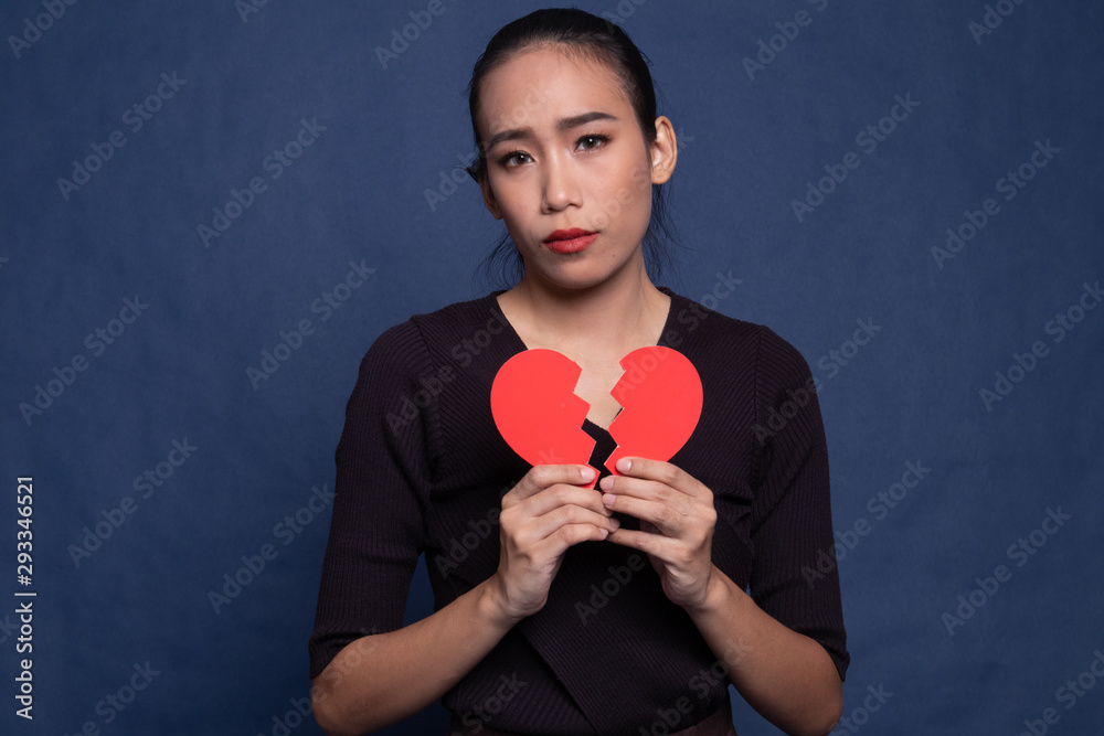 Beautiful young Asian woman with broken heart. Beautiful young Asian woman with broken heart.