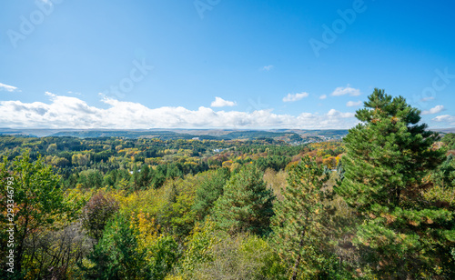 Kislovodsk resort park from above: tops of colorful trees, mountains and sky © dmitriizotov