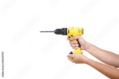 Yellow Cordless drill holding with Hand isolated on white background. COPY SPACE