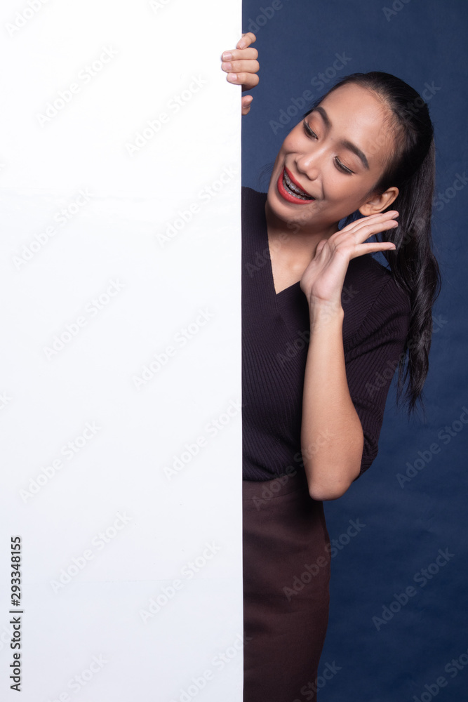 Excited young Asian woman with blank sign. Excited young Asian woman with blank sign.