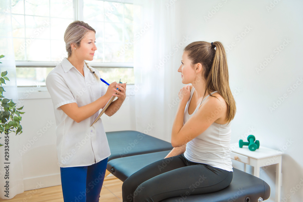 Fototapeta premium A Modern rehabilitation physiotherapist at work with client