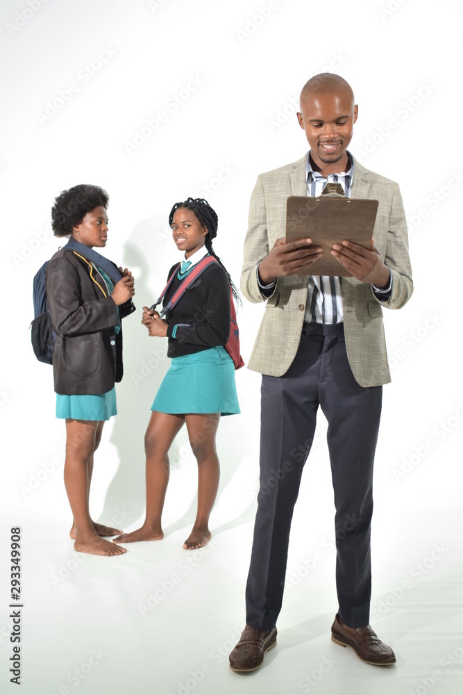 teacher and two female students wearing school uniform teacher and two female students wearing school uniform
