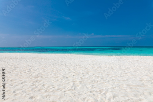 Fototapeta Naklejka Na Ścianę i Meble -  Empty beach landscape. Sea sand sky concept. Calmness and loneliness concept of beach view and horizon under blue sky