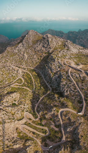 High mountain serpentine road vertical drone photo. Mallorca, Spain.