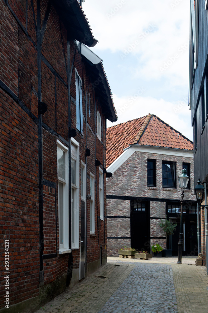 View through alley in historic Dutch city Ootmarsem, Overijssel, Netherlands