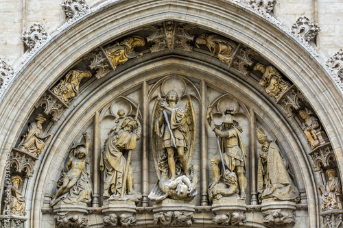 Medieval statues on historical facade of City Hall on Grand Place in Brussels, Belgium