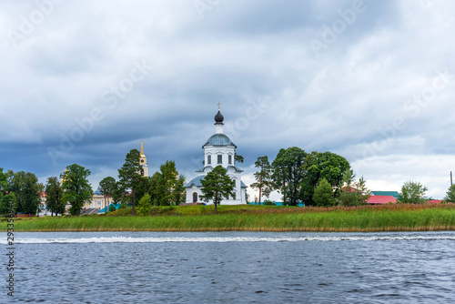 Picturesque view of Nilo Stolobensky Monastery on Lake Seliger, Tver region, Russia. Panoramic view of Nilo Stolobensky Monastery, Tver region, Russia. photo