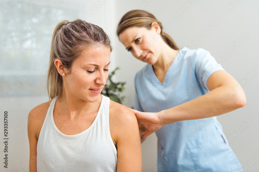A Modern rehabilitation physiotherapist at work with client A Modern rehabilitation physiotherapist at work with client